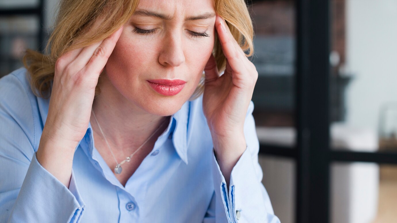stressed-blond-business-woman-holding-head_23-2148095759