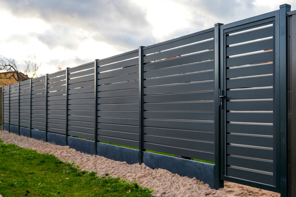 A,Newly,Installed,Dark,Gray,Metal,Privacy,Fence,With,A